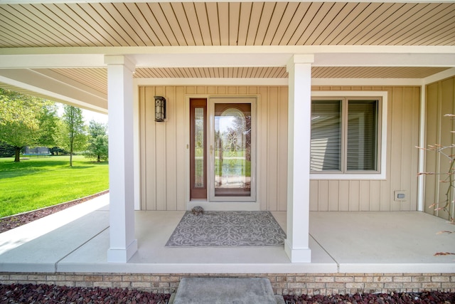 1287 Deer Run, Grass Lake, MI 49240 - view of exterior entry featuring a porch and a yard