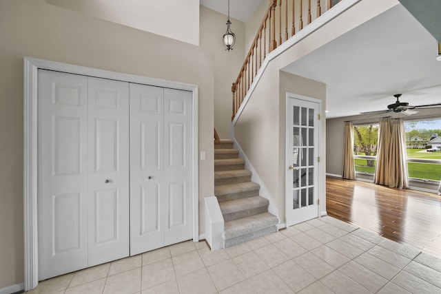 1287 Deer Run, Grass Lake, MI 49240 - foyer featuring stairs, light tile patterned floors, a ceiling fan, and baseboards