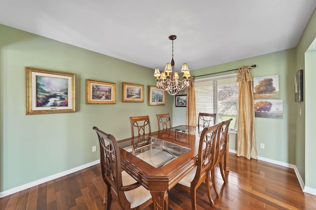 1287 Deer Run, Grass Lake, MI 49240 - dining space featuring a chandelier, dark wood-style floors, and baseboards