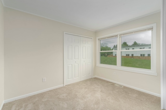 1141 Marquette Ct, Rochester Hills, MI 48307 - unfurnished bedroom with carpet flooring, baseboards, and a closet