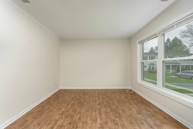 1141 Marquette Ct, Rochester Hills, MI 48307 - unfurnished room featuring light wood-type flooring, baseboards, and ornamental molding