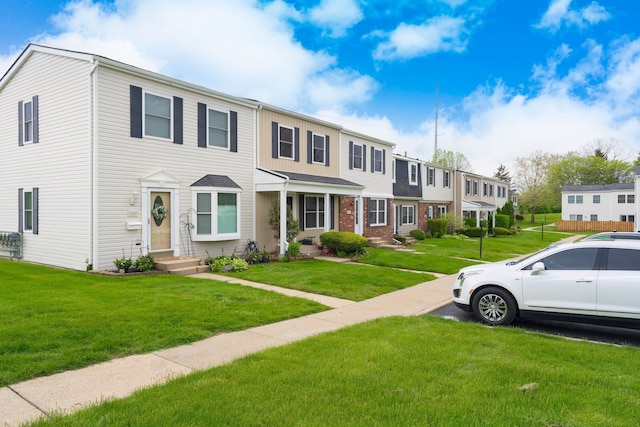 1141 Marquette Ct, Rochester Hills, MI 48307 - multi unit property featuring a residential view, a front yard, and brick siding