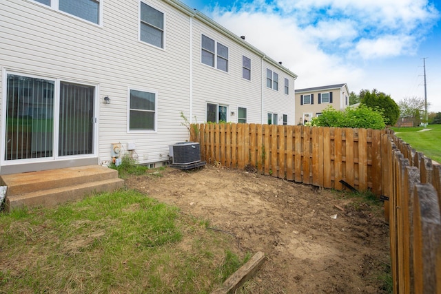 1141 Marquette Ct, Rochester Hills, MI 48307 - view of yard with fence, entry steps, and central AC unit