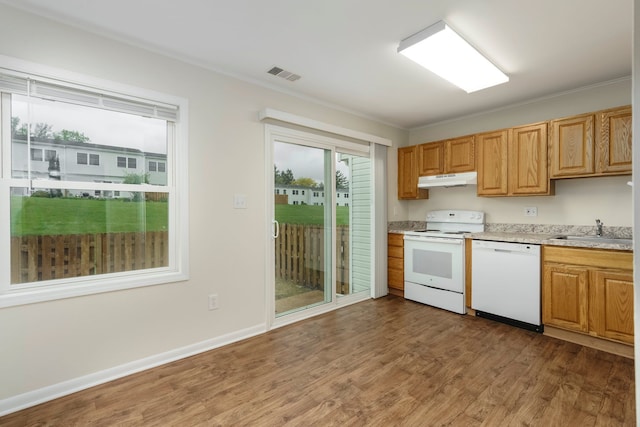 1141 Marquette Ct, Rochester Hills, MI 48307 - kitchen with white appliances, under cabinet range hood, a sink, wood finished floors, and ornamental molding
