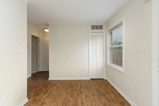 1141 Marquette Ct, Rochester Hills, MI 48307 - spare room with wood finished floors, baseboards, and ornamental molding