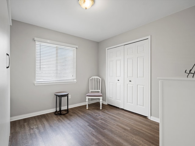 sitting room featuring wood finished floors and baseboards