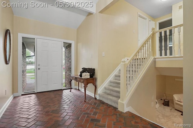 29290 Prestwick St, Southfield, MI 48076 - foyer entrance featuring baseboards, stairway, and brick flooring