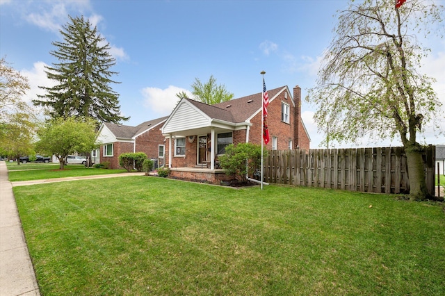 1818 Cora St, Wyandotte, MI 48192 - bungalow-style house with brick siding and a chimney