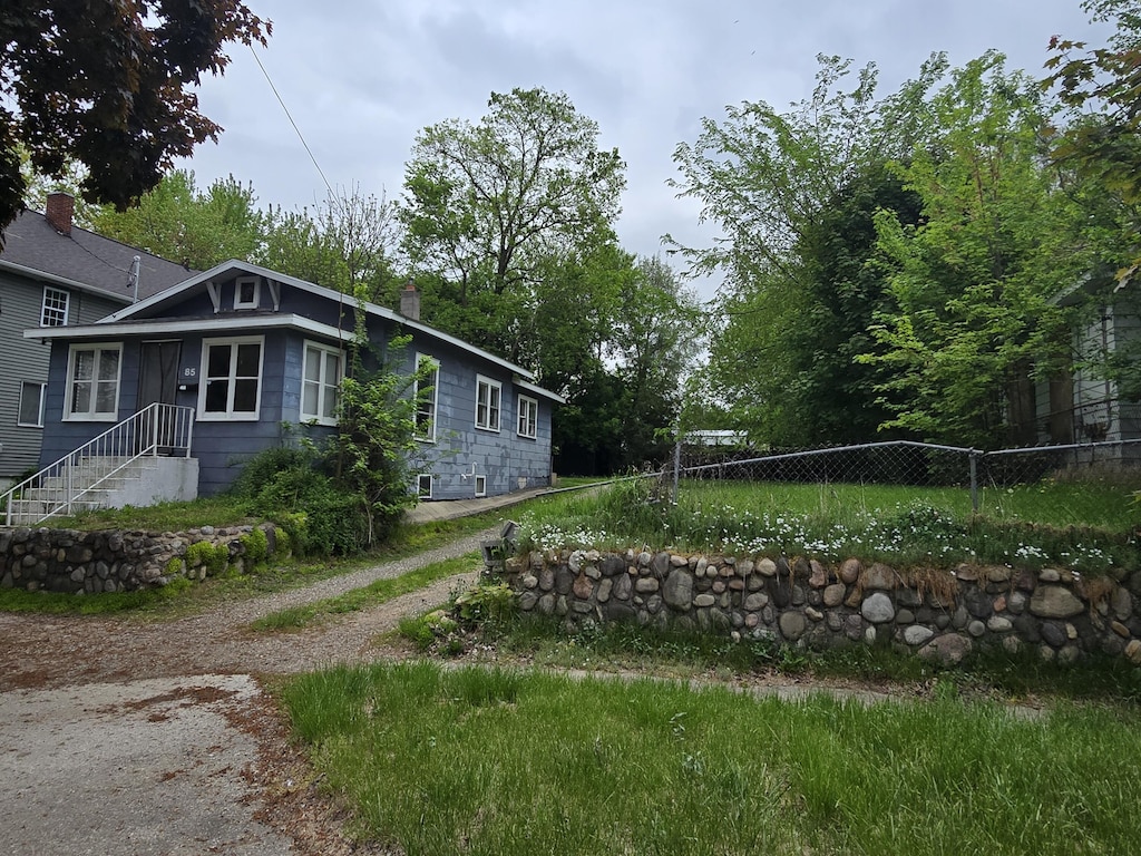 view of property exterior featuring fence