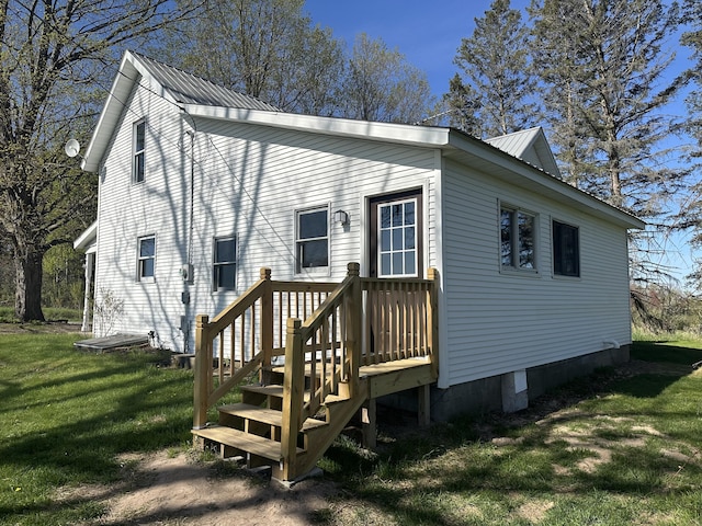 5342 E Fountain Rd, Fountain, MI 49410 - view of property exterior featuring a metal roof and a yard