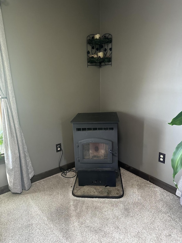 5342 E Fountain Rd, Fountain, MI 49410 - detailed view of a wood stove and carpet flooring