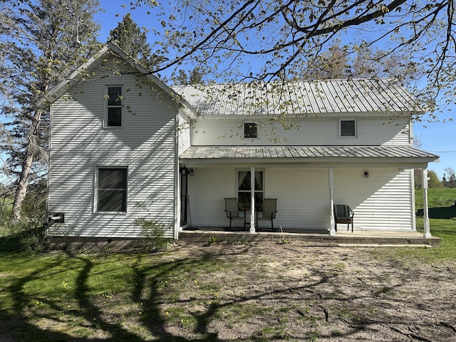 5342 E Fountain Rd, Fountain, MI 49410 - back of property featuring a porch, a metal roof, and a yard