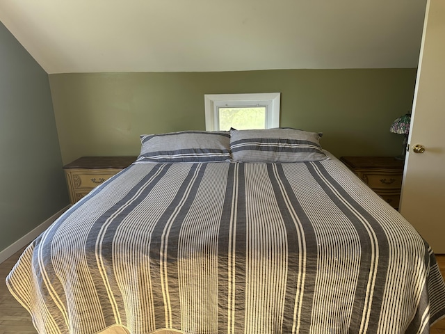 5342 E Fountain Rd, Fountain, MI 49410 - bedroom with vaulted ceiling and wood finished floors