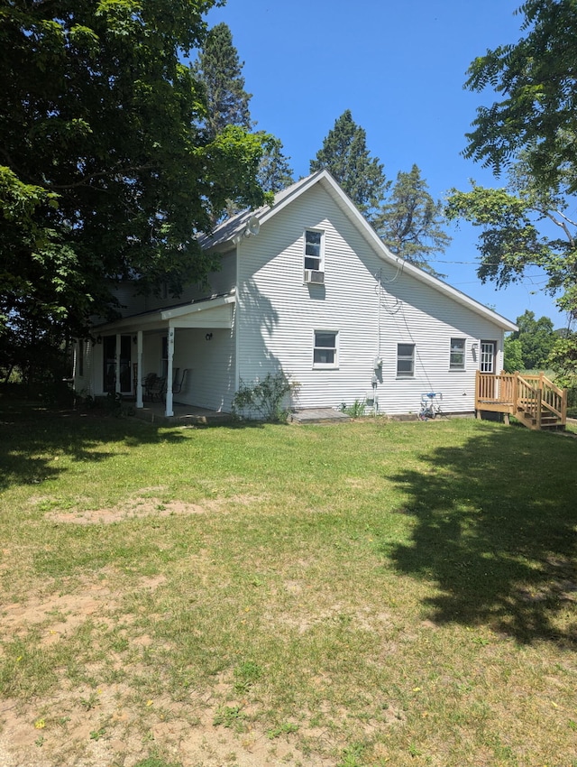 5342 E Fountain Rd, Fountain, MI 49410 - back of house with a lawn and a deck