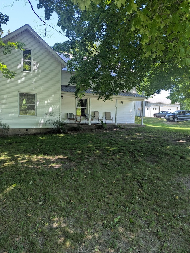 5342 E Fountain Rd, Fountain, MI 49410 - back of property with a yard and a patio