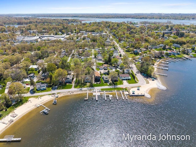 15926 Beach Dr, Spring Lake, MI 49456 - aerial view of property and surrounding area featuring a nearby body of water, nearby suburban area, and a tree filled landscape