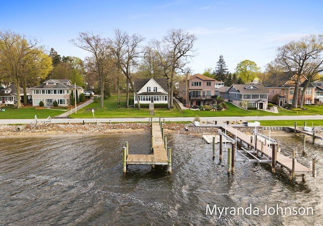 15926 Beach Dr, Spring Lake, MI 49456 - dock area featuring a water view, a yard, boat lift, and a residential view