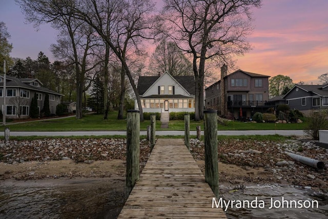 15926 Beach Dr, Spring Lake, MI 49456 - dock with a yard