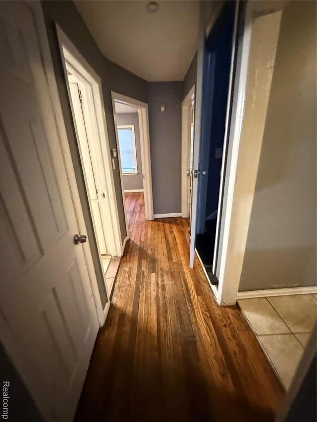 7766 Clayburn St, Detroit, MI 48228 - hall featuring wood-type flooring and baseboards
