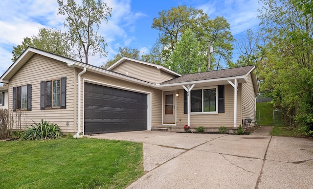 3884 Cass Elizabeth Rd, Waterford, MI 48328 - view of front of house featuring driveway, a garage, and a front lawn