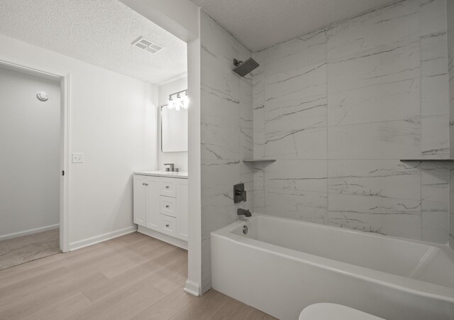 3884 Cass Elizabeth Rd, Waterford, MI 48328 - full bath with vanity, wood finished floors, shower / washtub combination, and a textured ceiling