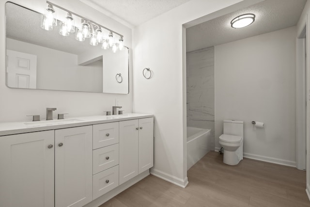 3884 Cass Elizabeth Rd, Waterford, MI 48328 - full bathroom with double vanity, a textured ceiling, and wood finished floors