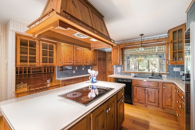 2103 E Newark Rd, Lapeer, MI 48446 - kitchen with black appliances, a sink, light countertops, and light wood-style floors