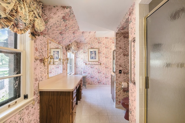 2103 E Newark Rd, Lapeer, MI 48446 - bathroom with wallpapered walls, toilet, tile patterned flooring, an enclosed shower, and baseboards