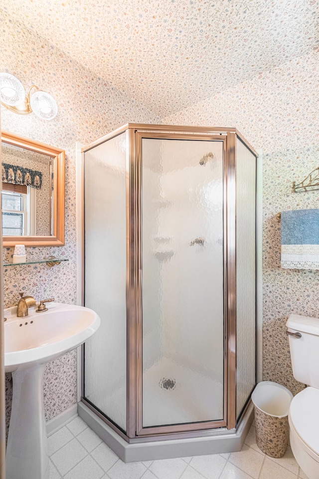 2103 E Newark Rd, Lapeer, MI 48446 - bathroom with wallpapered walls, a stall shower, tile patterned floors, and toilet