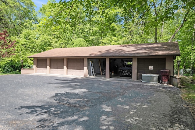 2103 E Newark Rd, Lapeer, MI 48446 - garage featuring central AC unit