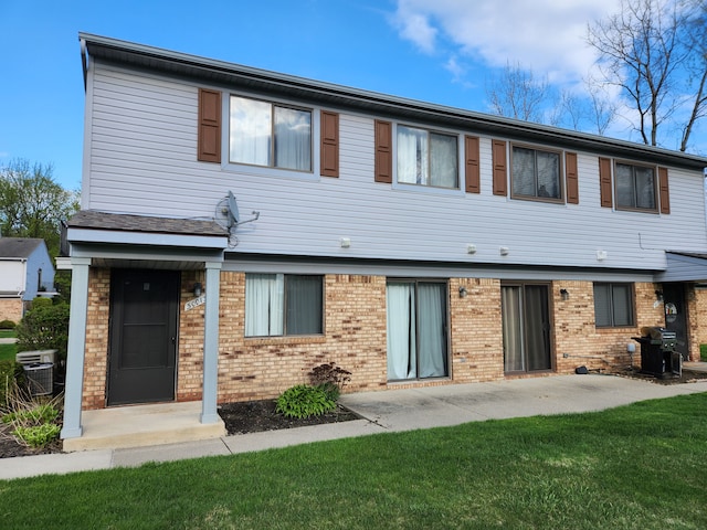 50013 S Jimmy, Chesterfield, MI 48047 - back of property with brick siding, central AC unit, a yard, and a patio area