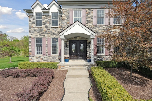 1840 Tapadera Dr, Ann Arbor, MI 48103 - doorway to property featuring stone siding