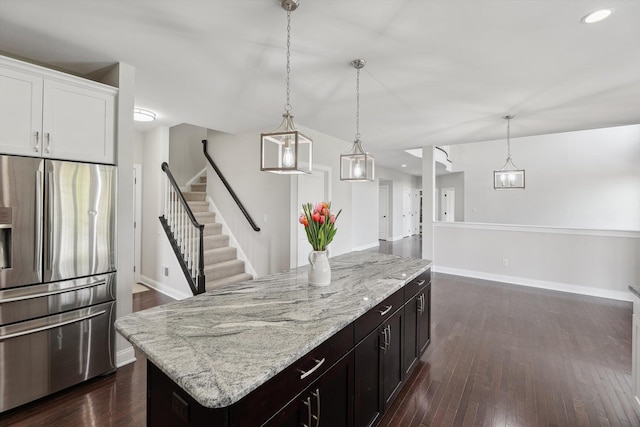 1840 Tapadera Dr, Ann Arbor, MI 48103 - kitchen featuring stainless steel refrigerator with ice dispenser, a kitchen island, baseboards, open floor plan, and recessed lighting