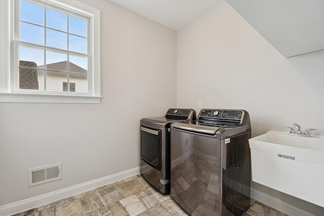 1840 Tapadera Dr, Ann Arbor, MI 48103 - laundry area with washer and clothes dryer and baseboards