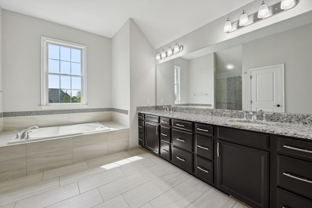 1840 Tapadera Dr, Ann Arbor, MI 48103 - bathroom featuring a stall shower, a garden tub, double vanity, and tile patterned flooring