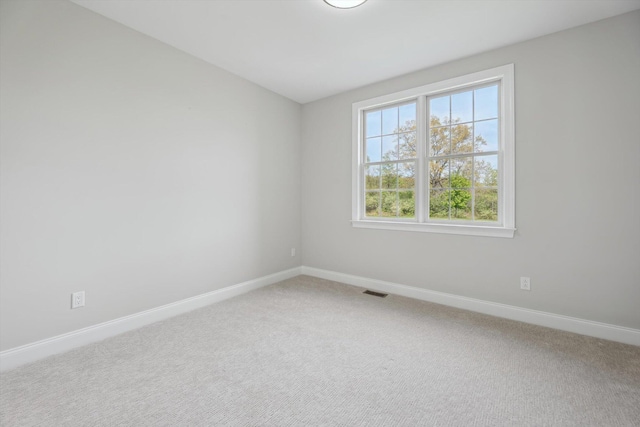 1840 Tapadera Dr, Ann Arbor, MI 48103 - unfurnished room with baseboards and light carpet