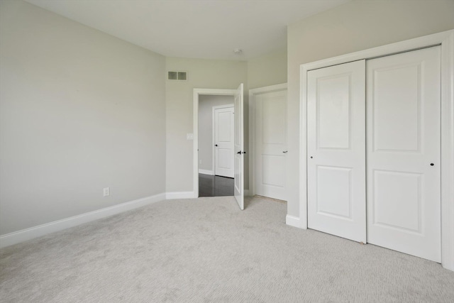1840 Tapadera Dr, Ann Arbor, MI 48103 - unfurnished bedroom featuring carpet flooring, a closet, and baseboards