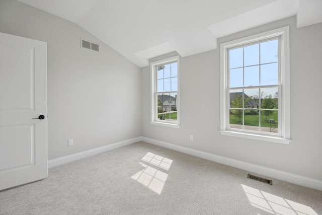1840 Tapadera Dr, Ann Arbor, MI 48103 - unfurnished room featuring lofted ceiling, baseboards, and carpet flooring