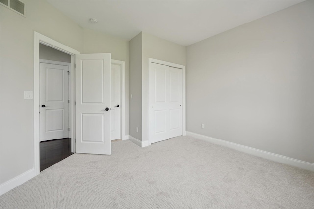1840 Tapadera Dr, Ann Arbor, MI 48103 - unfurnished bedroom featuring light colored carpet, baseboards, and a closet