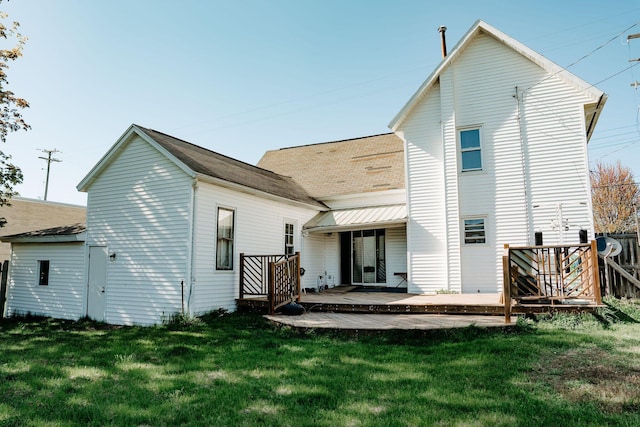109 E 5th St, Shelby, MI 49455 - back of house featuring roof with shingles
