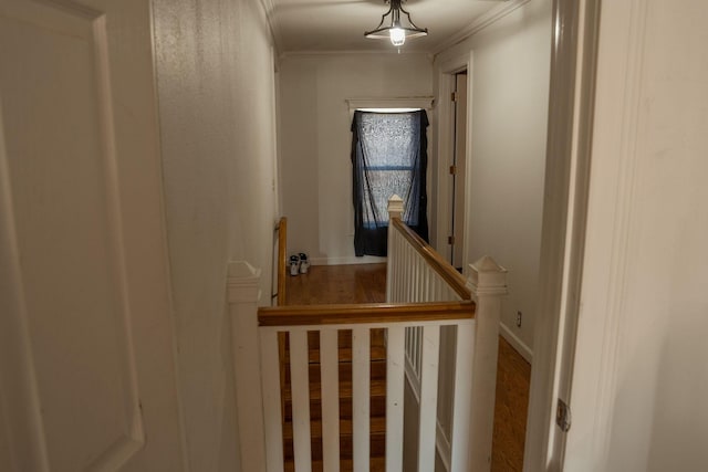 109 E 5th St, Shelby, MI 49455 - staircase with crown molding, wood finished floors, and baseboards