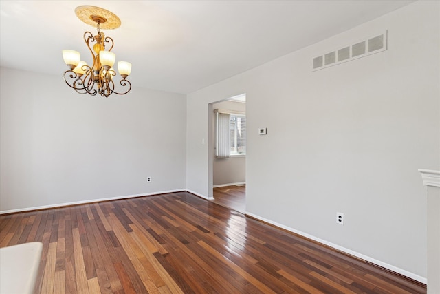 2374 Berwick Dr, Canton, MI 48188 - empty room with a chandelier, baseboards, and wood finished floors