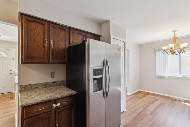 2374 Berwick Dr, Canton, MI 48188 - kitchen featuring stainless steel refrigerator with ice dispenser, light wood-style flooring, a chandelier, pendant lighting, and baseboards