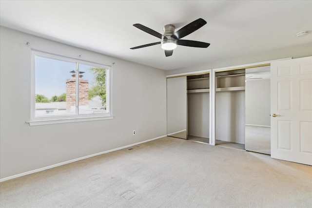 2374 Berwick Dr, Canton, MI 48188 - unfurnished bedroom featuring two closets, carpet, baseboards, and ceiling fan