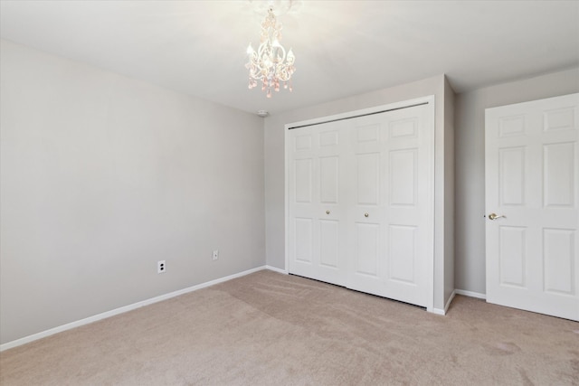 2374 Berwick Dr, Canton, MI 48188 - unfurnished bedroom with a chandelier, carpet, a closet, and baseboards