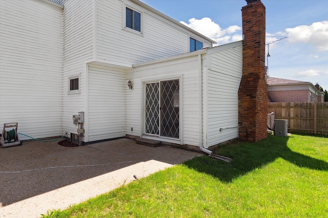 2374 Berwick Dr, Canton, MI 48188 - rear view of property featuring a patio area, central AC unit, and a chimney