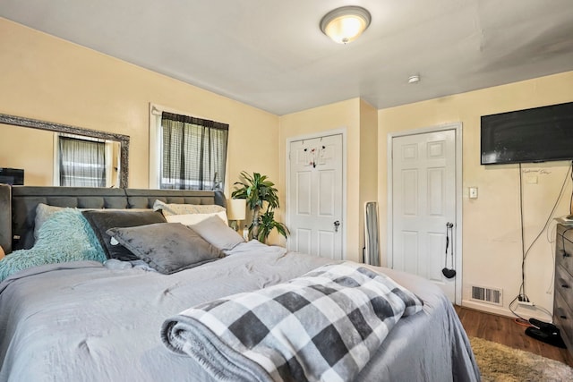 19433 Fenmore St, Detroit, MI 48235 - bedroom with dark wood-style flooring and baseboards