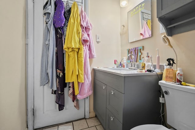19433 Fenmore St, Detroit, MI 48235 - bathroom with toilet, tile patterned flooring, and vanity