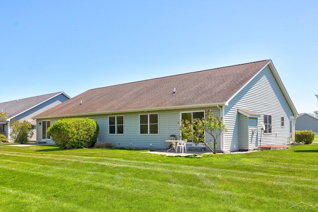 1 Sanctuary Way, Freeland, MI 48623 - rear view of property featuring a patio, a yard, and roof with shingles
