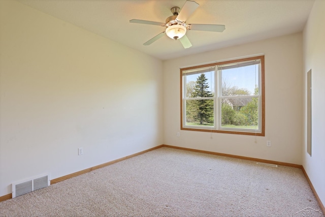 1 Sanctuary Way, Freeland, MI 48623 - spare room with light carpet, baseboards, and ceiling fan
